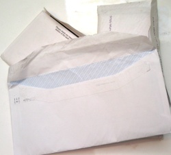 How can I reuse or recycle used envelopes?