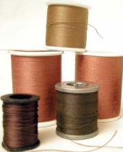 Reels of cotton on plastic bobbins