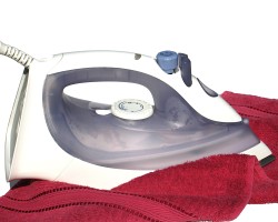 How can I reuse or recycle an old steam iron?