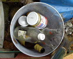 How can I make a waterproof(ish) recycling bin from recycled stuff?