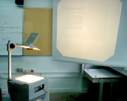 How can I reuse or recycle overhead projector transparencies?