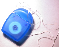 How can I reuse or recycle dental floss packaging
