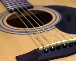 How can I reuse or recycle guitar strings?