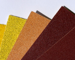 How can I reuse or recycle worn out sandpaper?