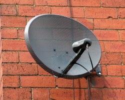 How can I reuse or recycle old satellite dishes?